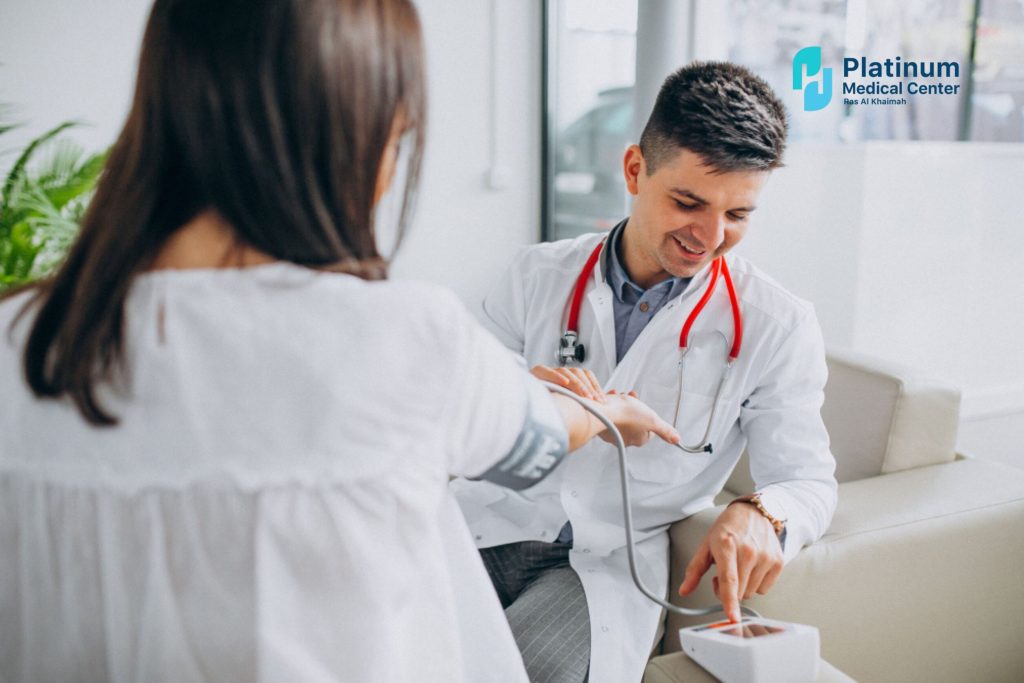 Doctor consulting with a patient during a routine health checkup, discussing symptoms and preventive care in a clinical setting